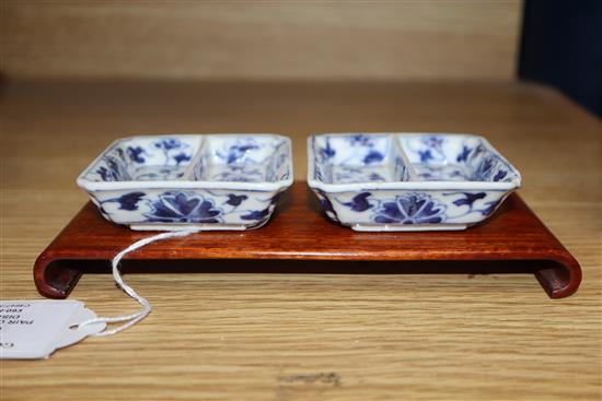 A pair of Chinese blue and white square dishes, Guangxu mark and period, hardwood stand